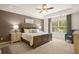 Main bedroom with tray ceiling and large windows at 328 Elgin Dr, Lawrenceville, GA 30045