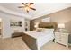 Main bedroom with plush carpet and large bed, showcasing tranquil decor at 328 Elgin Dr, Lawrenceville, GA 30045