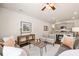 Open concept living room with kitchen view, featuring comfortable seating and a coffee table at 308 Elgin Dr, Lawrenceville, GA 30045