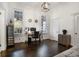 Home office with built-in shelving and hardwood floors at 4197 Sentinel Post Nw Rd, Atlanta, GA 30327