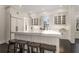 White kitchen features a large island, stainless steel appliances, and hardwood floors at 4197 Sentinel Post Nw Rd, Atlanta, GA 30327