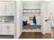 White entryway with built-in bench seating and storage at 3739 Tielman St, Snellville, GA 30078
