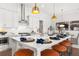 Island kitchen with white cabinets, quartz countertops, and gold pendant lights at 3739 Tielman St, Snellville, GA 30078