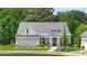 Two-story home with brick and stone accents, and a welcoming front porch at 3739 Tielman St, Snellville, GA 30078