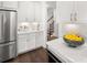 White kitchen cabinets and quartz countertops with stainless steel appliances at 3739 Tielman St, Snellville, GA 30078