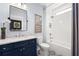 Modern bathroom with a navy vanity and patterned floor at 3739 Tielman St, Snellville, GA 30078