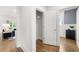 Bright hallway with hardwood floors and access to living area and closet at 3739 Tielman St, Snellville, GA 30078