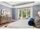 Main bedroom with a cozy sitting area and large windows at 3739 Tielman St, Snellville, GA 30078