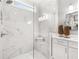 Spacious shower with marble tile and built-in seat at 3739 Tielman St, Snellville, GA 30078