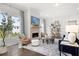 Living room with fireplace, large windows, and open floor plan at 3739 Tielman St, Snellville, GA 30078