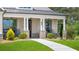 Inviting front porch with stone columns, comfortable seating, and lush landscaping at 3739 Tielman St, Snellville, GA 30078