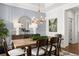 Elegant dining room featuring a wood table and statement wall at 3739 Tielman St, Snellville, GA 30078