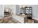 Bright home office featuring a desk and built-in shelving at 3739 Tielman St, Snellville, GA 30078