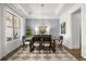 Bright dining room with hardwood floors and a stunning chandelier at 3739 Tielman St, Snellville, GA 30078