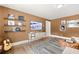 Bonus room with a large TV, guitar, and shelves at 3739 Tielman St, Snellville, GA 30078