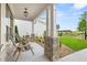Spacious front porch with stone accents, two chairs and a view of the yard at 3739 Tielman St, Snellville, GA 30078