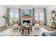 Comfortable living room featuring a fireplace and ample natural light at 3739 Tielman St, Snellville, GA 30078