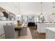 Open concept kitchen features white cabinets, large island, and breakfast area at 3739 Tielman St, Snellville, GA 30078