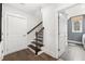 Stairwell leading to upper level with laundry room access at 3739 Tielman St, Snellville, GA 30078
