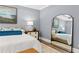 Main bedroom featuring a large mirror and comfy bedding at 3739 Tielman St, Snellville, GA 30078