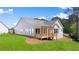 White house with a large deck and grassy backyard at 3739 Tielman St, Snellville, GA 30078
