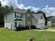 Two-story house with stone and vinyl siding, attached two-car garage at 2112 Bradford Pear Se Cir, Conyers, GA 30013