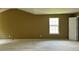 Large bedroom with vaulted ceiling and carpet at 2112 Bradford Pear Se Cir, Conyers, GA 30013