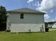 Two-story house with vinyl siding, large backyard, and partial view of neighborhood at 2112 Bradford Pear Se Cir, Conyers, GA 30013