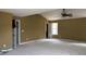 Large main bedroom with carpet and en-suite bath access at 2112 Bradford Pear Se Cir, Conyers, GA 30013