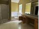 Main bathroom with soaking tub and double vanity at 2112 Bradford Pear Se Cir, Conyers, GA 30013
