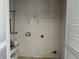 Empty laundry room with hookups and shelving at 2112 Bradford Pear Se Cir, Conyers, GA 30013