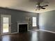 Living room with fireplace and dark hardwood floors at 2112 Bradford Pear Se Cir, Conyers, GA 30013