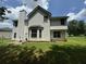 Two-story house with vinyl siding, large yard, and mature trees at 2112 Bradford Pear Se Cir, Conyers, GA 30013
