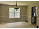 Simple dining room with a large window and neutral walls at 2112 Bradford Pear Se Cir, Conyers, GA 30013