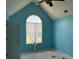 Bright bedroom with a large arched window at 2112 Bradford Pear Se Cir, Conyers, GA 30013
