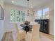 Elegant dining room with an oval table, chandelier, and built-in hutch at 1956 Deco Dr, Kennesaw, GA 30144