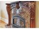 Ornate fireplace with marble surround and gas logs at 1197 Lynmoor Ne Dr, Brookhaven, GA 30319