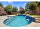 Freeform swimming pool with a relaxing spa and water features at 1197 Lynmoor Ne Dr, Brookhaven, GA 30319