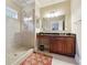 Bathroom with granite vanity, large shower, and tile flooring at 1197 Lynmoor Ne Dr, Brookhaven, GA 30319