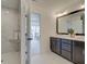 Elegant bathroom featuring double vanity and a walk-in shower at 1996 Deco Dr, Kennesaw, GA 30144