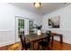 Dining room featuring hardwood floors and French doors leading to deck at 1143 Briarcliff Rd, Atlanta, GA 30306