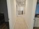 Upstairs hallway with carpet and access to bedrooms at 221 Eleanora Way, Loganville, GA 30052