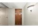 Inviting entryway with wood door and light fixture at 3435 Kingsboro Ne Rd # 1201, Atlanta, GA 30326