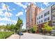 Upscale high-rise building with brick facade and manicured landscaping at 3435 Kingsboro Ne Rd # 1201, Atlanta, GA 30326