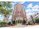 Brick building exterior with grand entrance and landscaping at 3435 Kingsboro Ne Rd # 1201, Atlanta, GA 30326