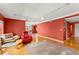 Open living area with hardwood floors and red walls at 3435 Kingsboro Ne Rd # 1201, Atlanta, GA 30326