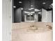 Corner bathtub with marble surround and modern fixtures at 3435 Kingsboro Ne Rd # 1201, Atlanta, GA 30326