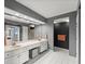 Double vanity bathroom with marble finishes and large mirror at 3435 Kingsboro Ne Rd # 1201, Atlanta, GA 30326