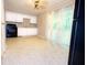 Kitchen with white cabinets, black appliances, and granite countertops at 6626 Dorian Dr, Union City, GA 30291