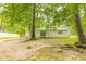 House with a large backyard and trees at 6626 Dorian Dr, Union City, GA 30291